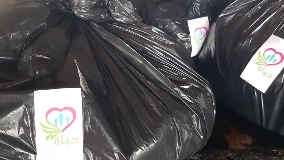 Distribution of meat and clothing to orphan families during Eid al-Adha